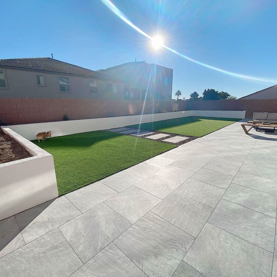 large tiles in a las Vegas back yard with artificial turf